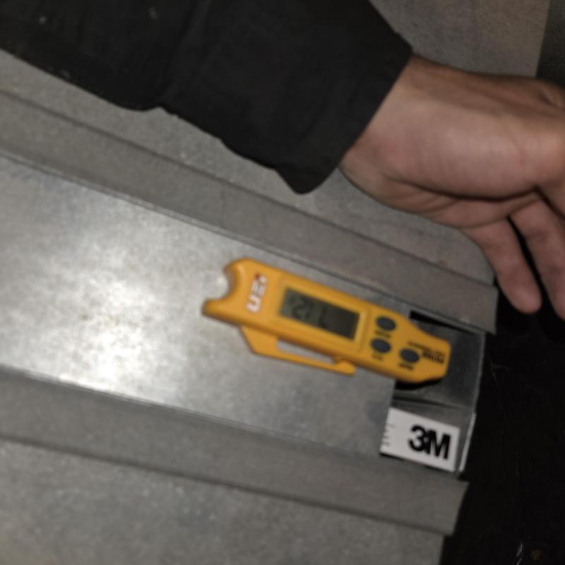 Temperature gauge on HVAC duct inspection with hand Temperature gauge on HVAC duct inspection with hand