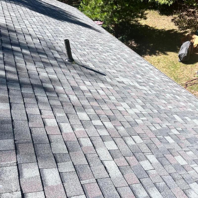 Asphalt shingle roof installation on residential home Asphalt shingle roof installation on residential home