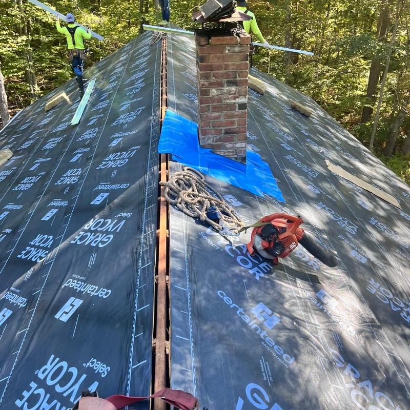 Roof underlayment installation around chimney ridge Roof underlayment installation around chimney ridge