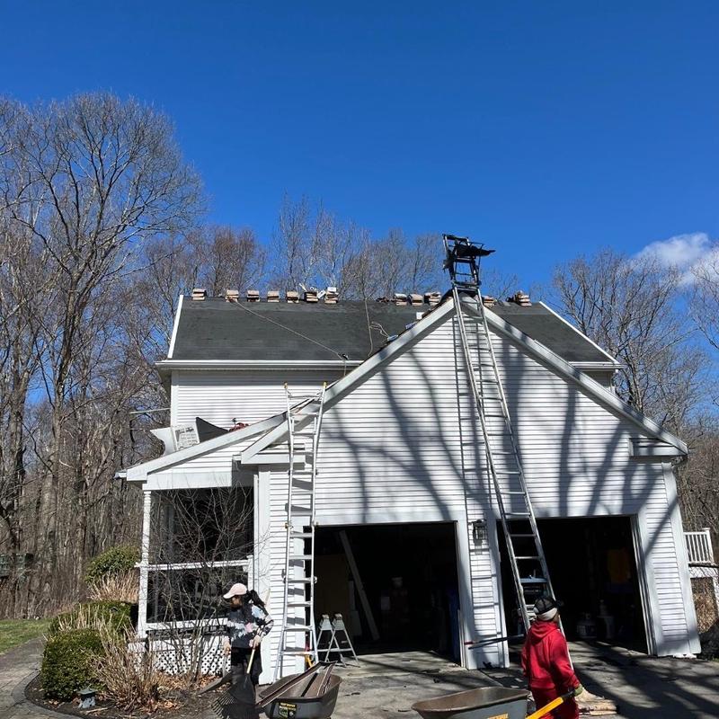 Asphalt shingle roof installation with ladders in Colchester Asphalt shingle roof installation with ladders in Colchester
