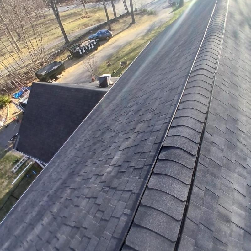Asphalt shingle roof with ridge vent installation Asphalt shingle roof with ridge vent installation