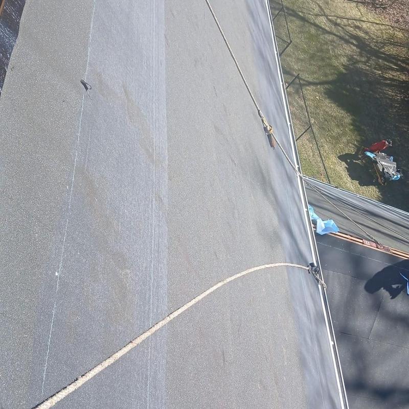 Flat roof installation with safety rope in Colchester CT Flat roof installation with safety rope in Colchester CT