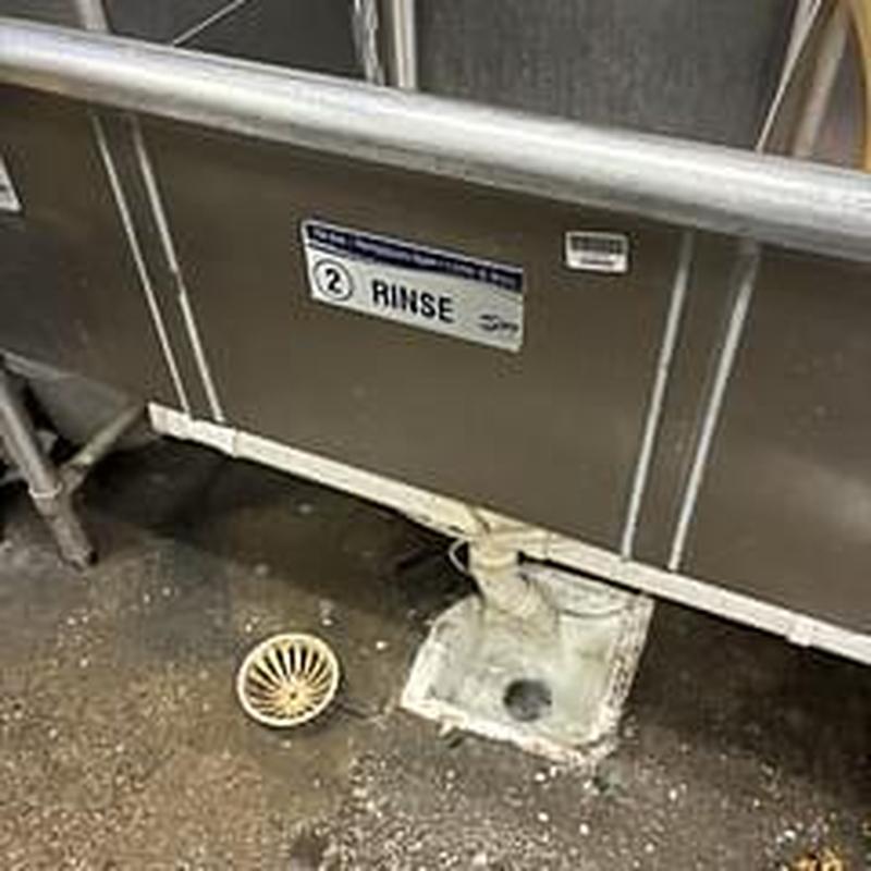 Grease trap inlet pipe cleaning at commercial sink Grease trap inlet pipe cleaning at commercial sink