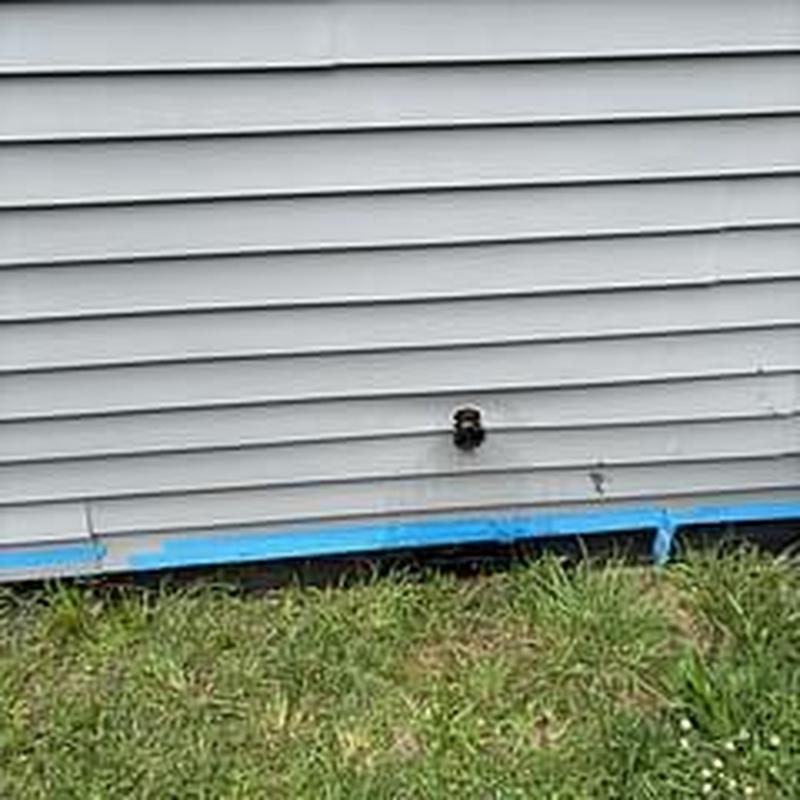 Hose bib installation on exterior house siding Hose bib installation on exterior house siding
