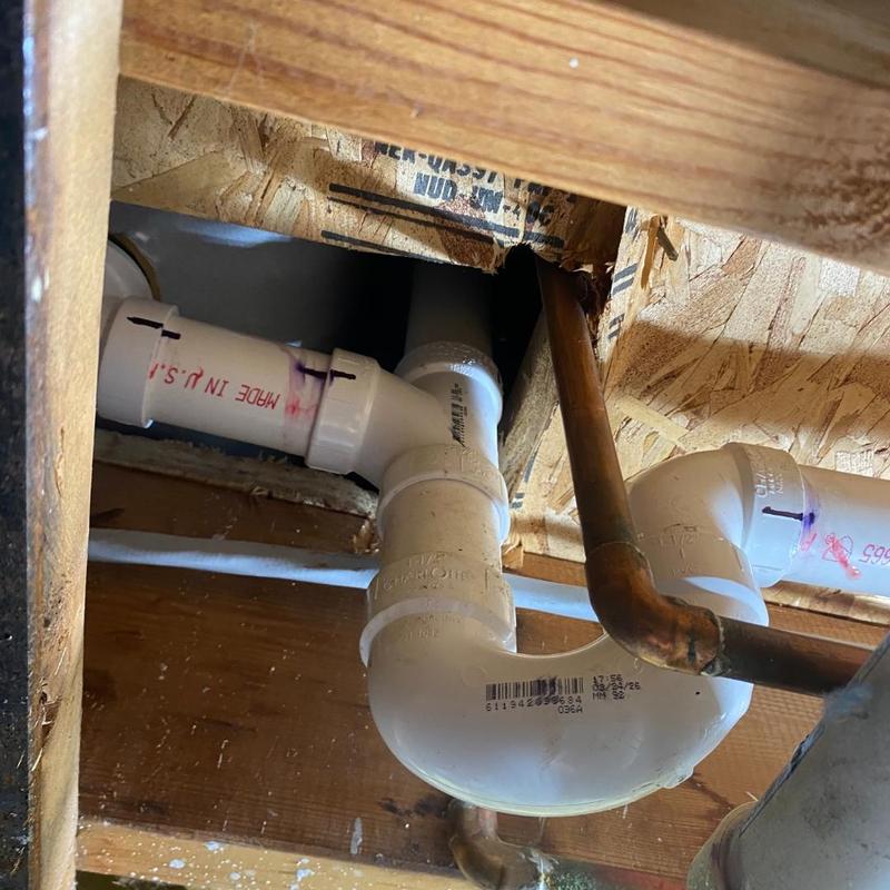 Shower drain pipe overflow fix under floor joist