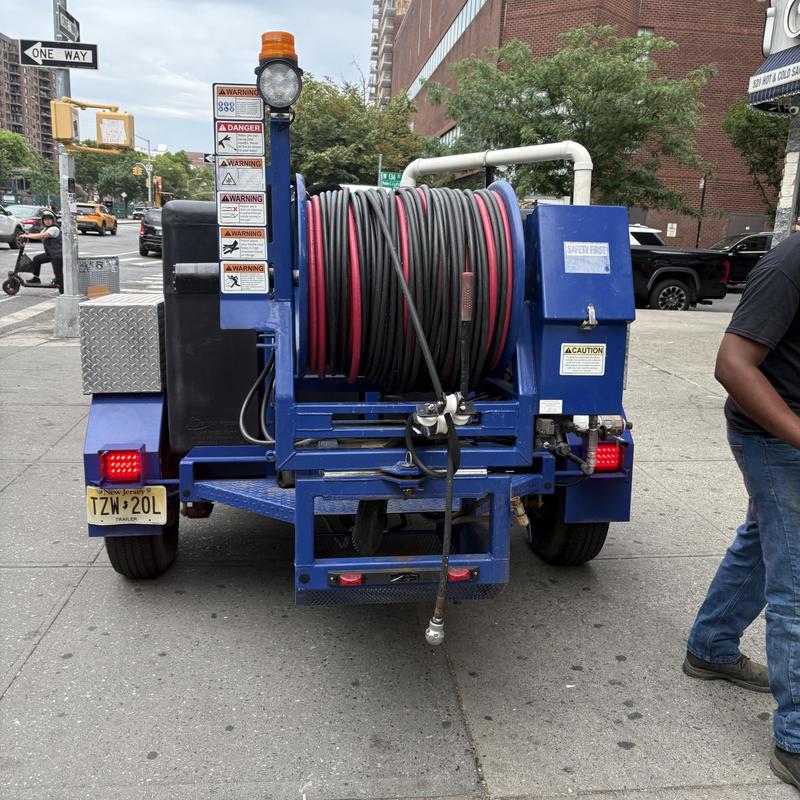 Sanitary drain cleaning hose reel trailer exterior Sanitary drain cleaning hose reel trailer exterior