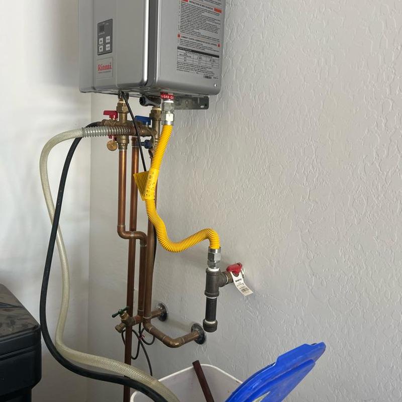 Tankless water heater cleaning with pump and hoses Tankless water heater cleaning with pump and hoses