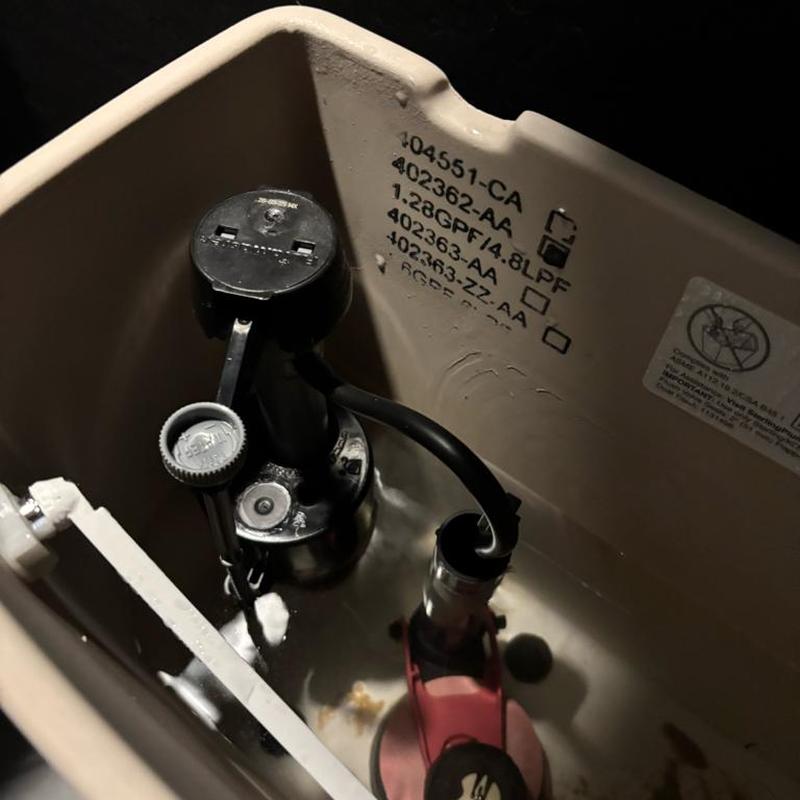 Toilet fill valve inside tank with replacement parts