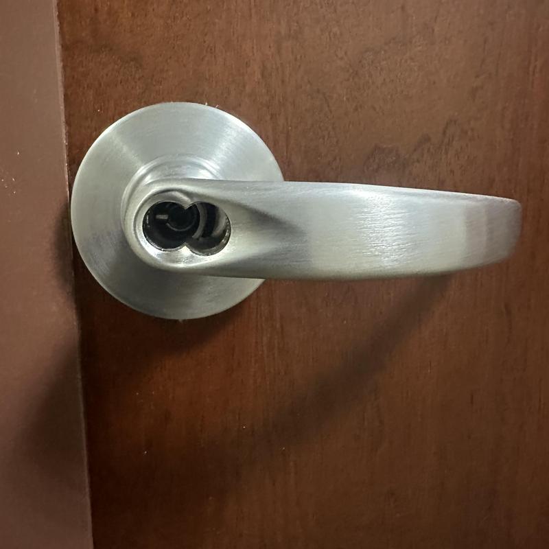 Electronic lever handle with removed cylinder on door Electronic lever handle with removed cylinder on door