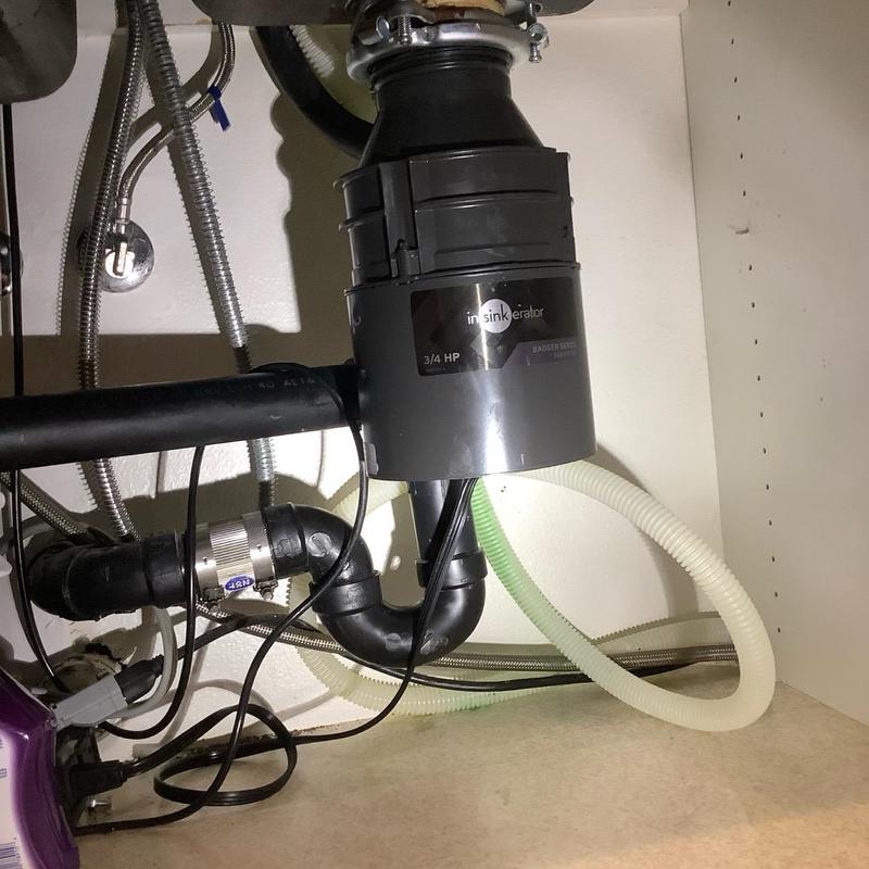 Garbage disposal installed with new flanges under sink Garbage disposal installed with new flanges under sink
