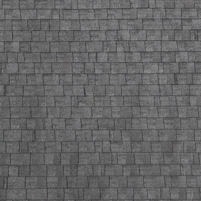 Asphalt shingle roof surface with hail damage inspection