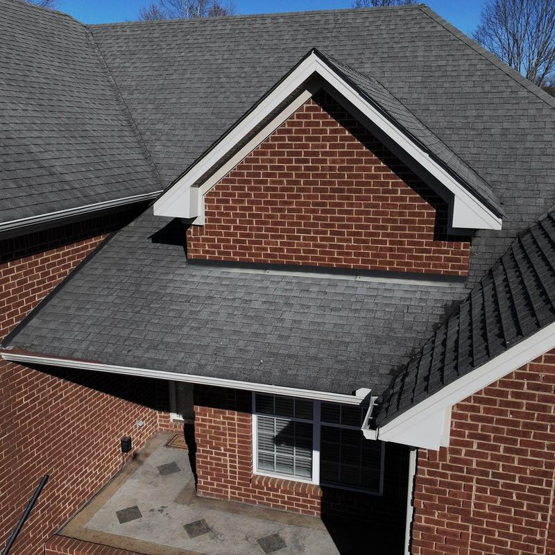 Asphalt shingle roof with hail damage inspection