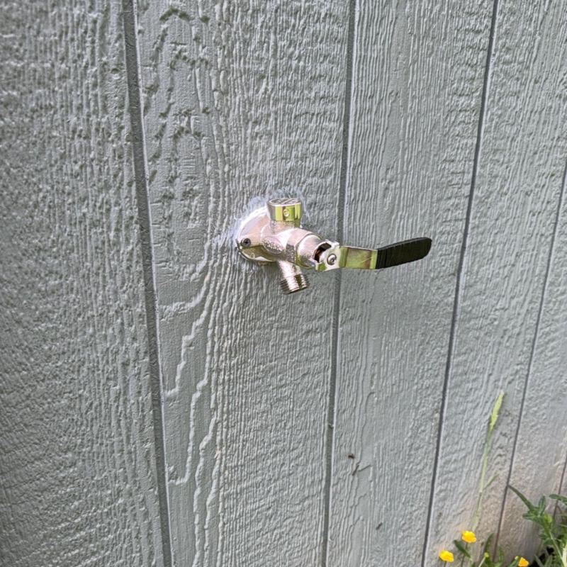 Frost free hose bib installed on exterior wall