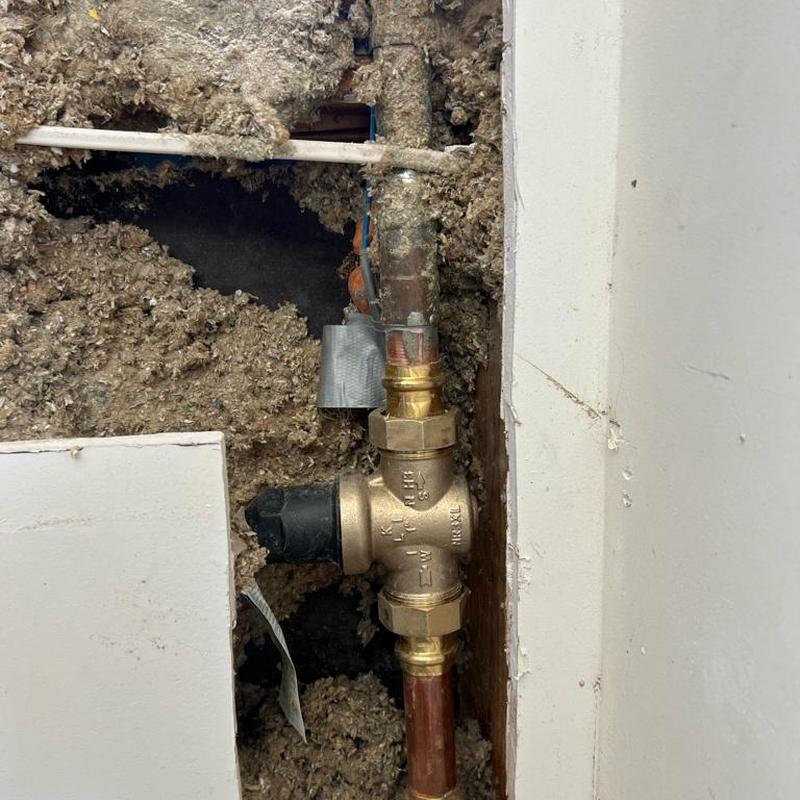 1-inch pressure-reducing valve installation in drywall cutout