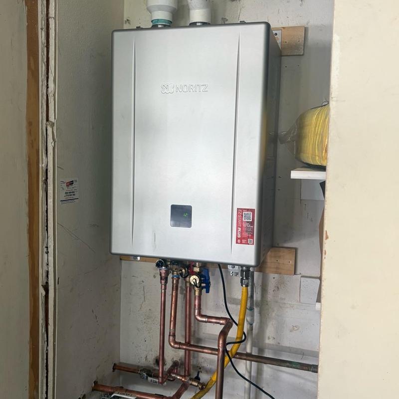 Tankless water heater with copper piping installed