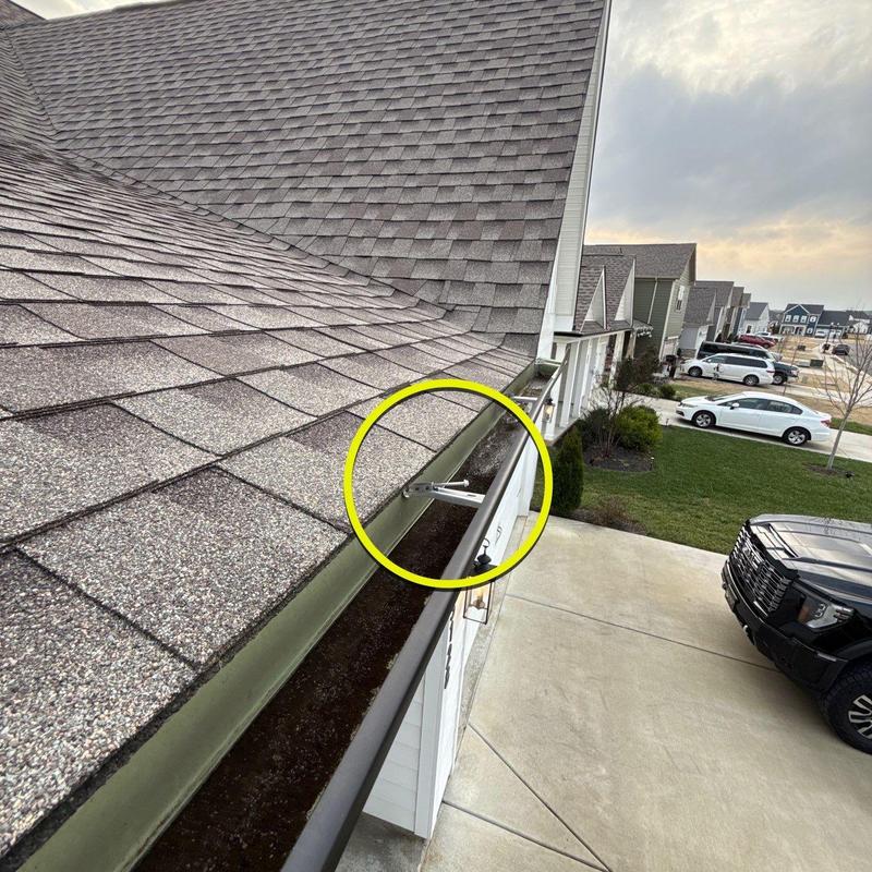 Roof gutter with mounting bracket inspection