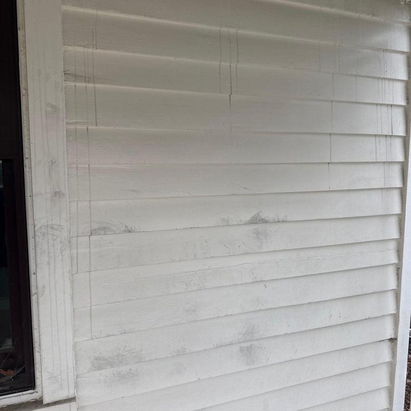 Vinyl siding with dirt and surface marks