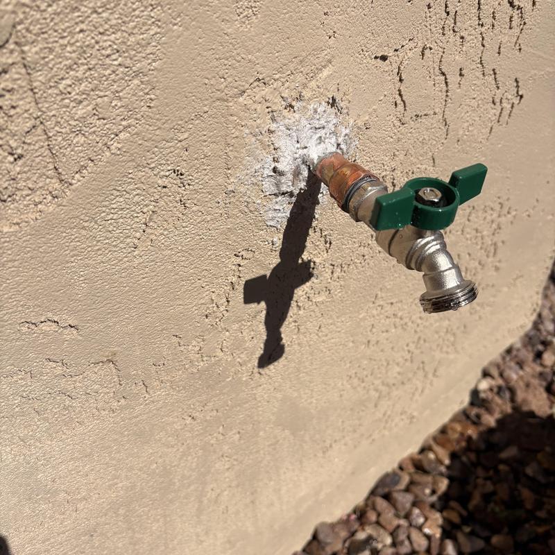 Copper hose bibb soldered and sealed on exterior wall Copper hose bibb soldered and sealed on exterior wall