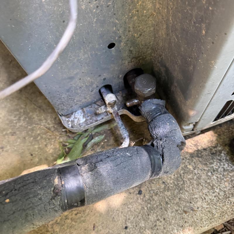 Air conditioner insulated refrigerant line damage close-up Air conditioner insulated refrigerant line damage close-up