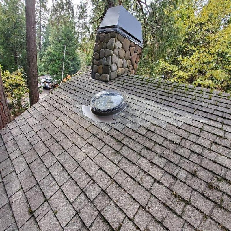 22-inch sun tunnel installed on roof near chimney