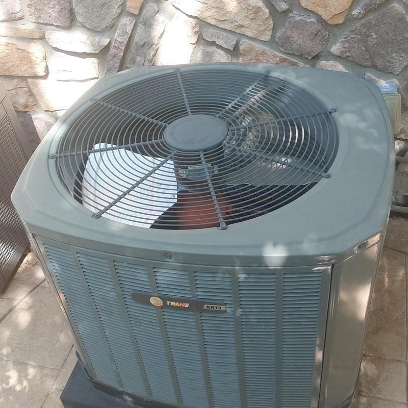 Trane XR13 air conditioner outdoor unit on patio