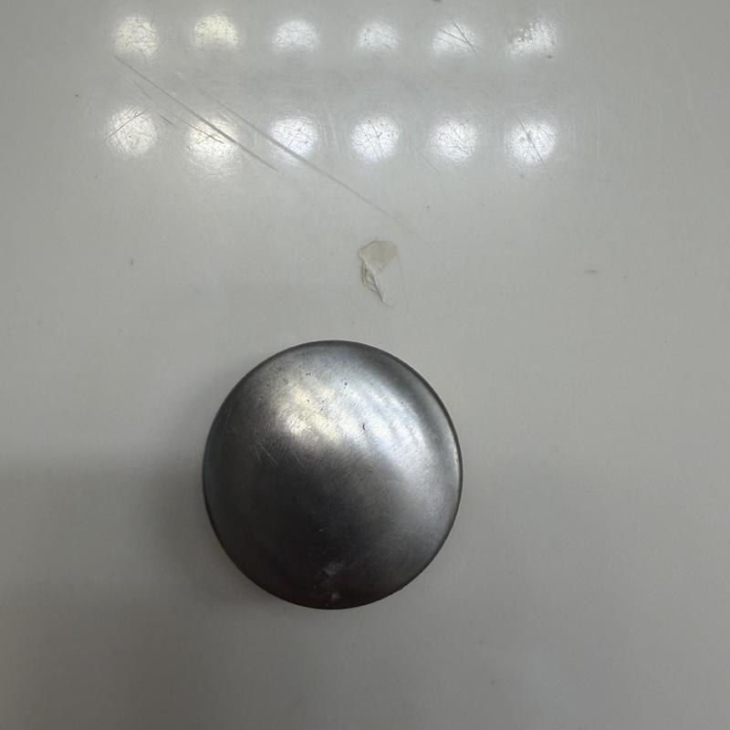 Tub stopper replacement part on white surface