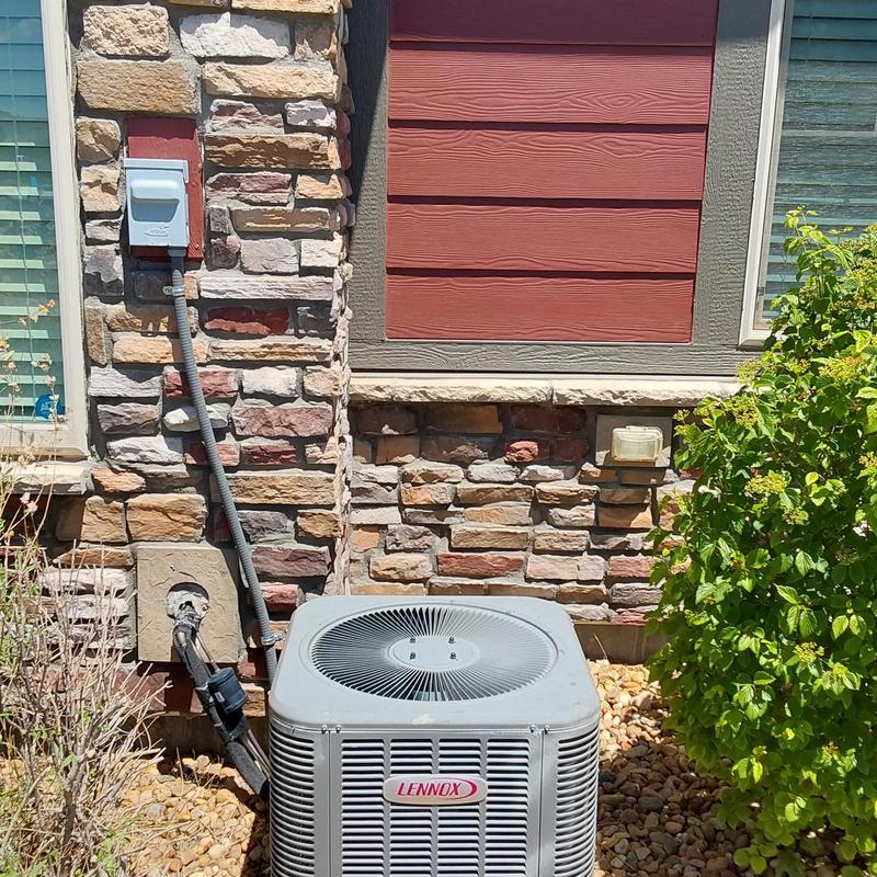 Lennox air conditioner unit outside home in Aurora, CO