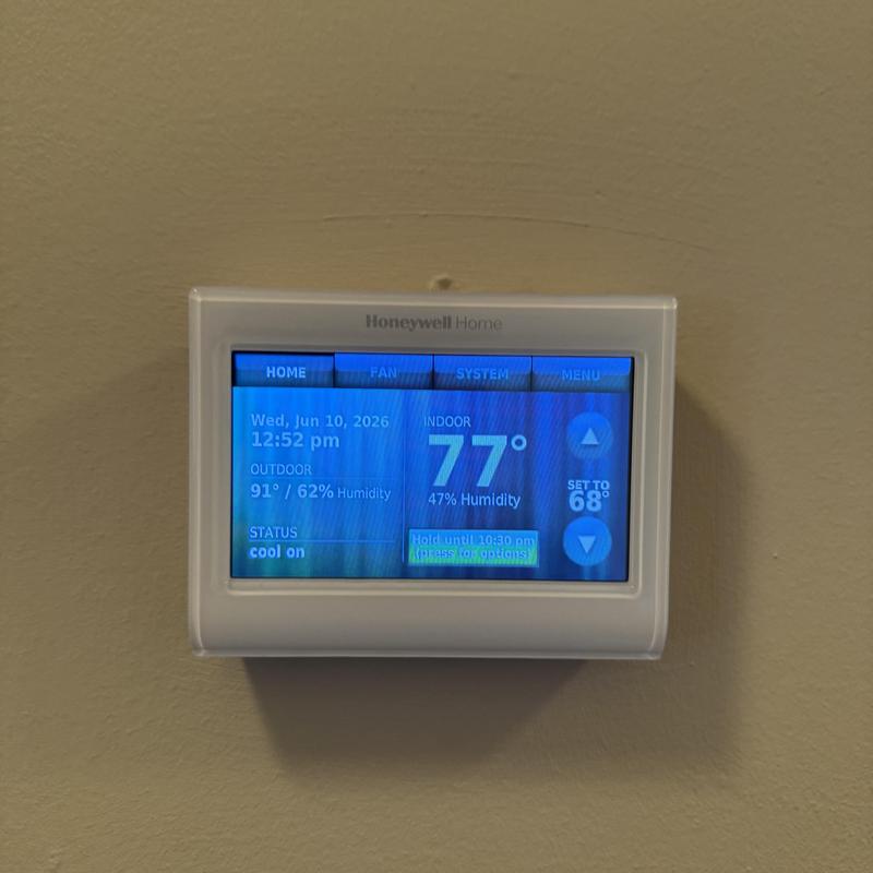 Honeywell thermostat displaying indoor and outdoor temps Honeywell thermostat displaying indoor and outdoor temps
