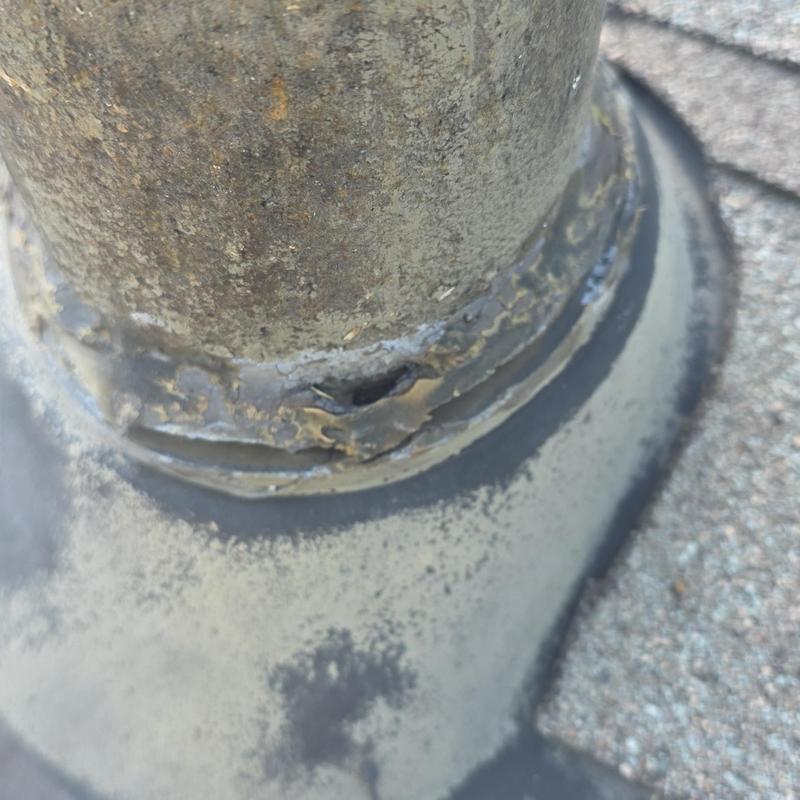 Roof vent pipe flashing with hail damage hole