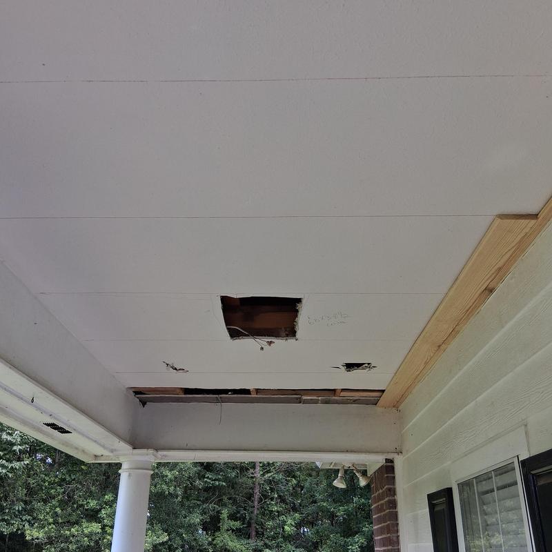 Ceiling drywall with holes for light demo and blocking added