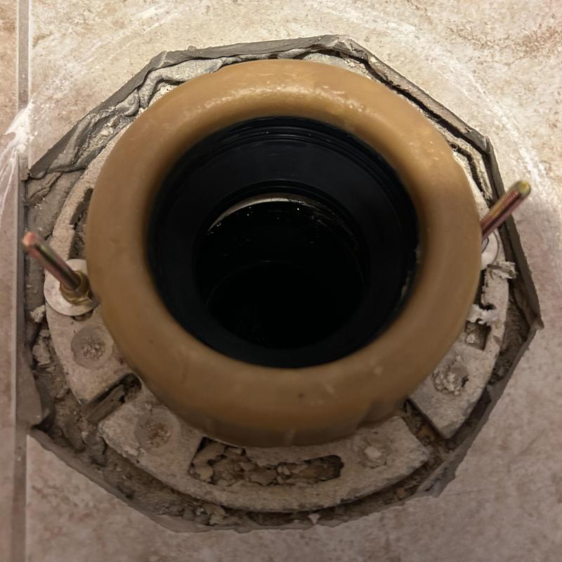 Toilet flange and wax ring on tile floor installation
