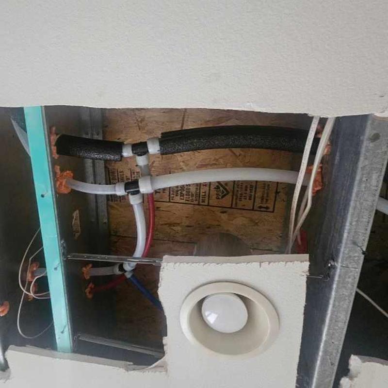 Uponor PEX piping whole house repipe in wall cavity