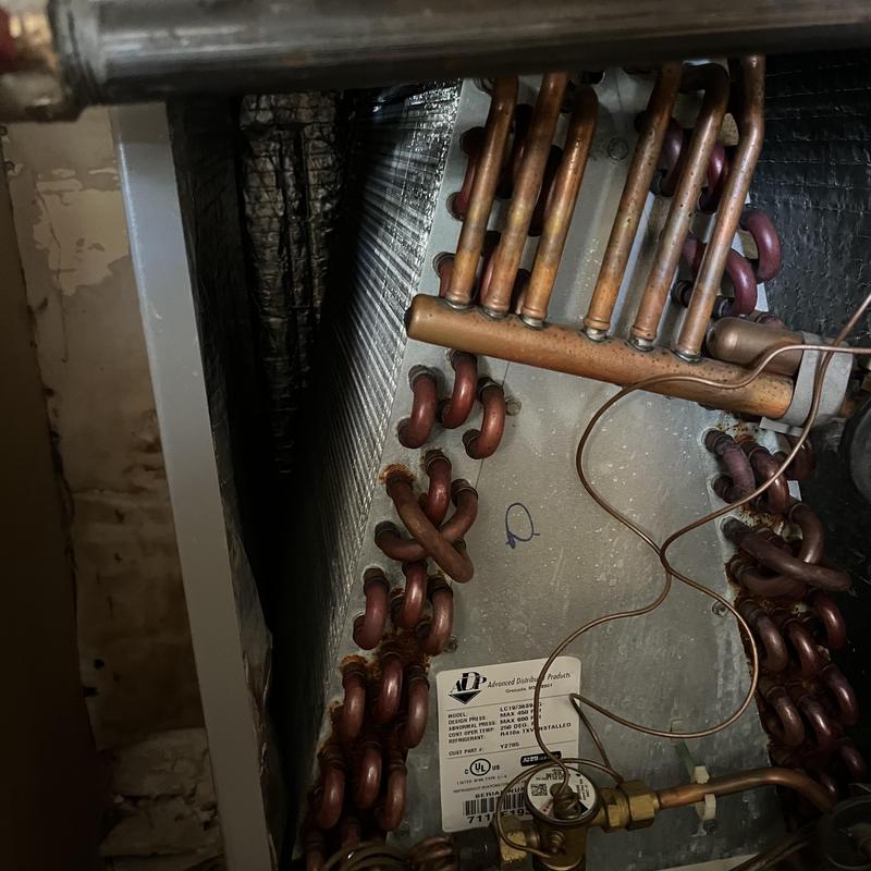 Evaporator coil and copper tubing inside HVAC unit Evaporator coil and copper tubing inside HVAC unit
