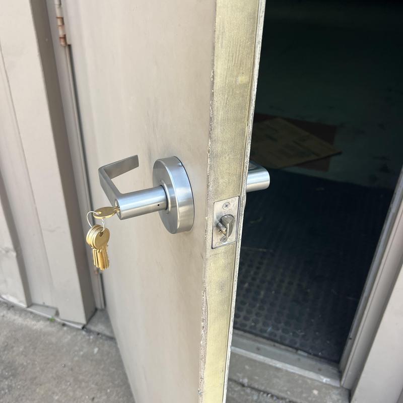 Door lock with keys on metal business entry door