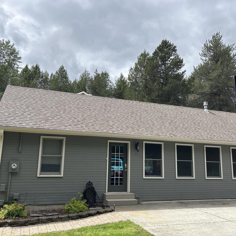 Asphalt shingle roof on residential house exterior