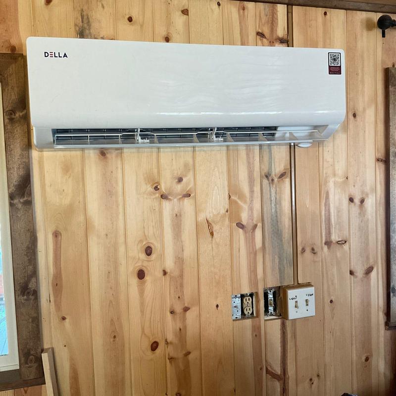 Mini split unit installation with power hookup on wood wall