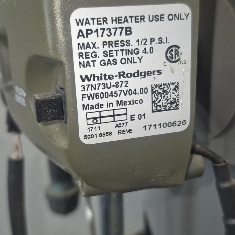 Water heater gas valve label close-up detail