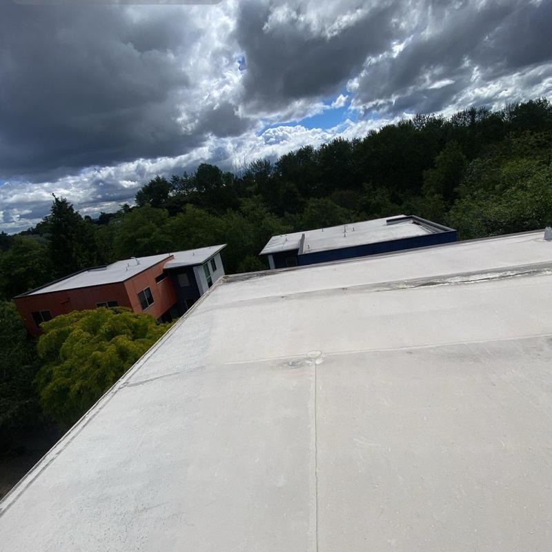 Flat roof surface with clean drainage edges in Seattle