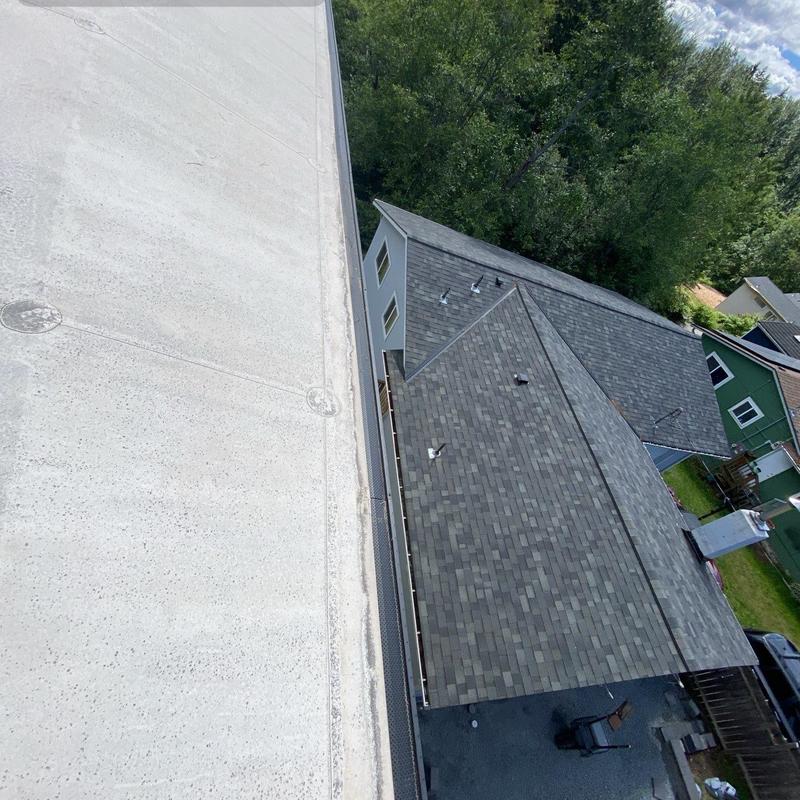 Flat roof and gutter cleaning with debris removal
