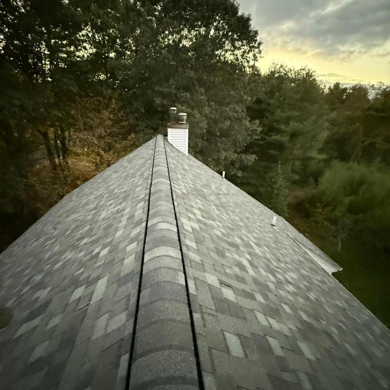 Asphalt shingle roof installation on residential home Asphalt shingle roof installation on residential home