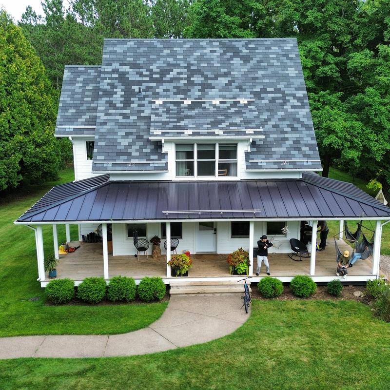 Synthetic slate roof with standing seam steel porch roof
