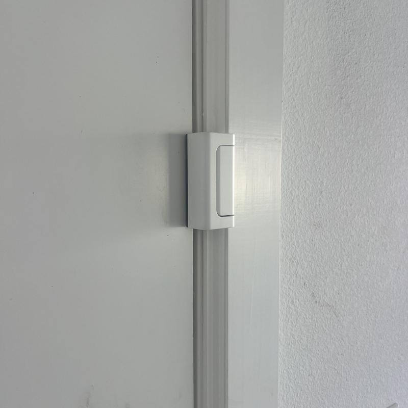 Door Guardian security sensor installed on door frame