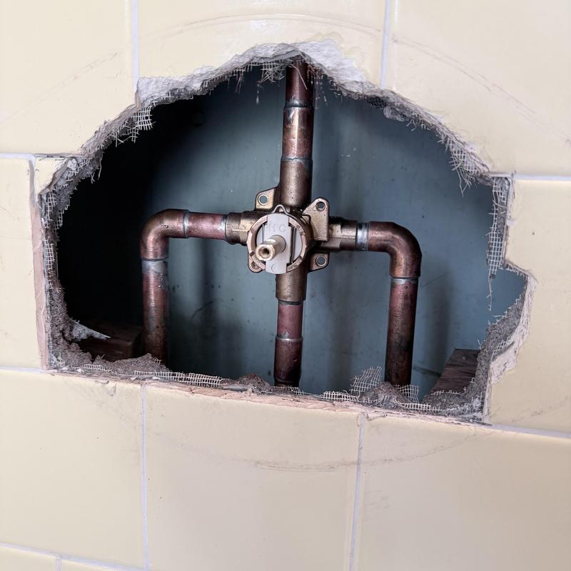 Shower valve and copper plumbing inside wall cavity
