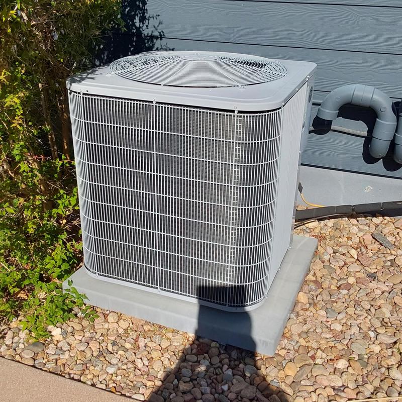 Carrier outdoor air conditioner unit on concrete pad