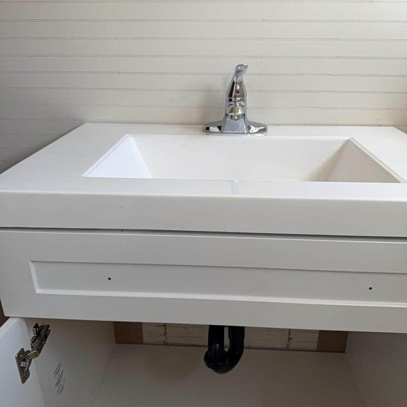 Bathroom sink with faucet and ABS drain piping installation