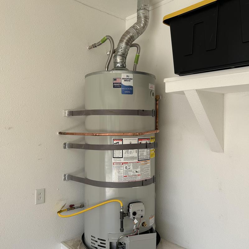 Natural gas water heater with new flex lines and sediment trap Natural gas water heater with new flex lines and sediment trap