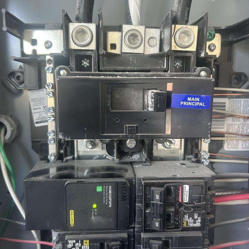 Main breaker panel with whole home surge protector installed
