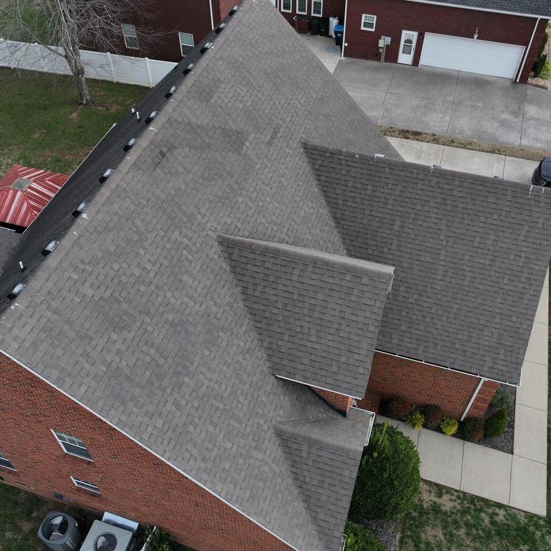 Asphalt shingle roof with visible hail damage inspection