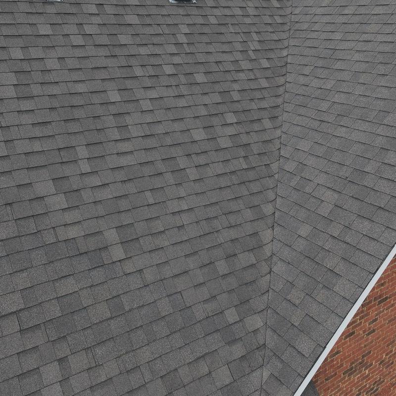 Asphalt shingle roof with hail damage inspection