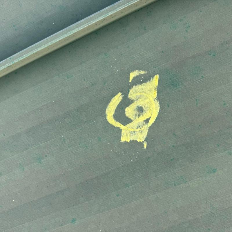 Commercial roofing membrane with hail damage mark